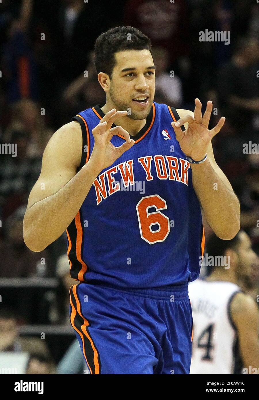 Landry Fields of the New York Knicks celebrates after hittiing a 3-point  shot with less than a minute left in the game against the New Jersey Nets  at the Prudential Center in