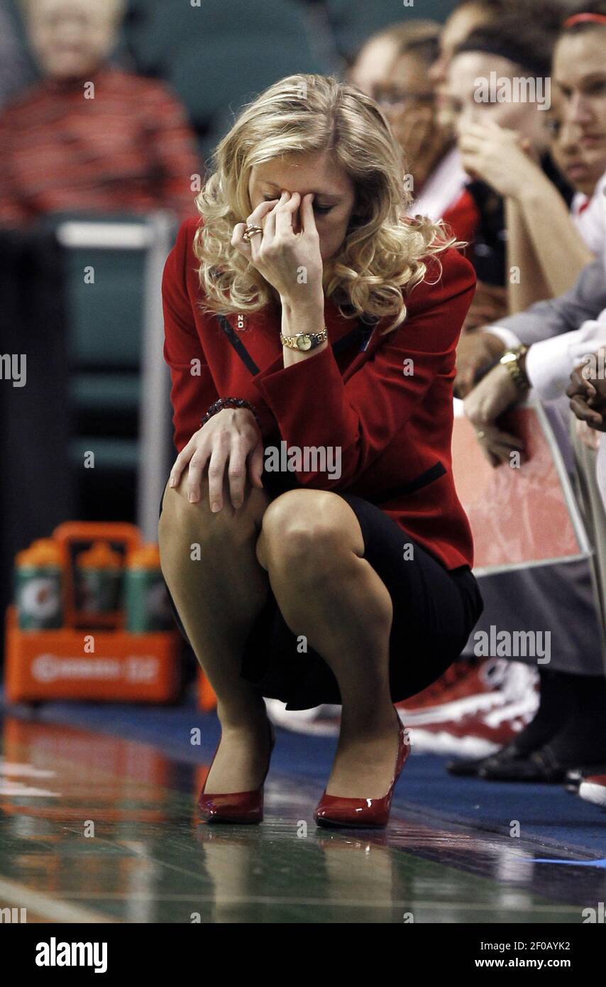 North Carolina State head coach Kellie Harper can t look as her
