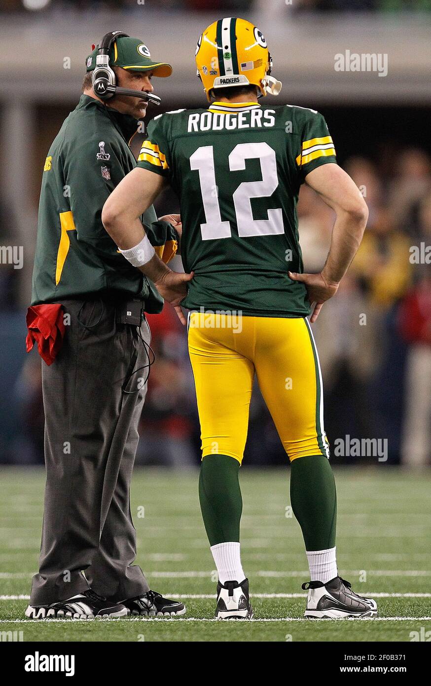 Green Bay Packers head coach Mike McCarthy relays a play to Green Bay ...