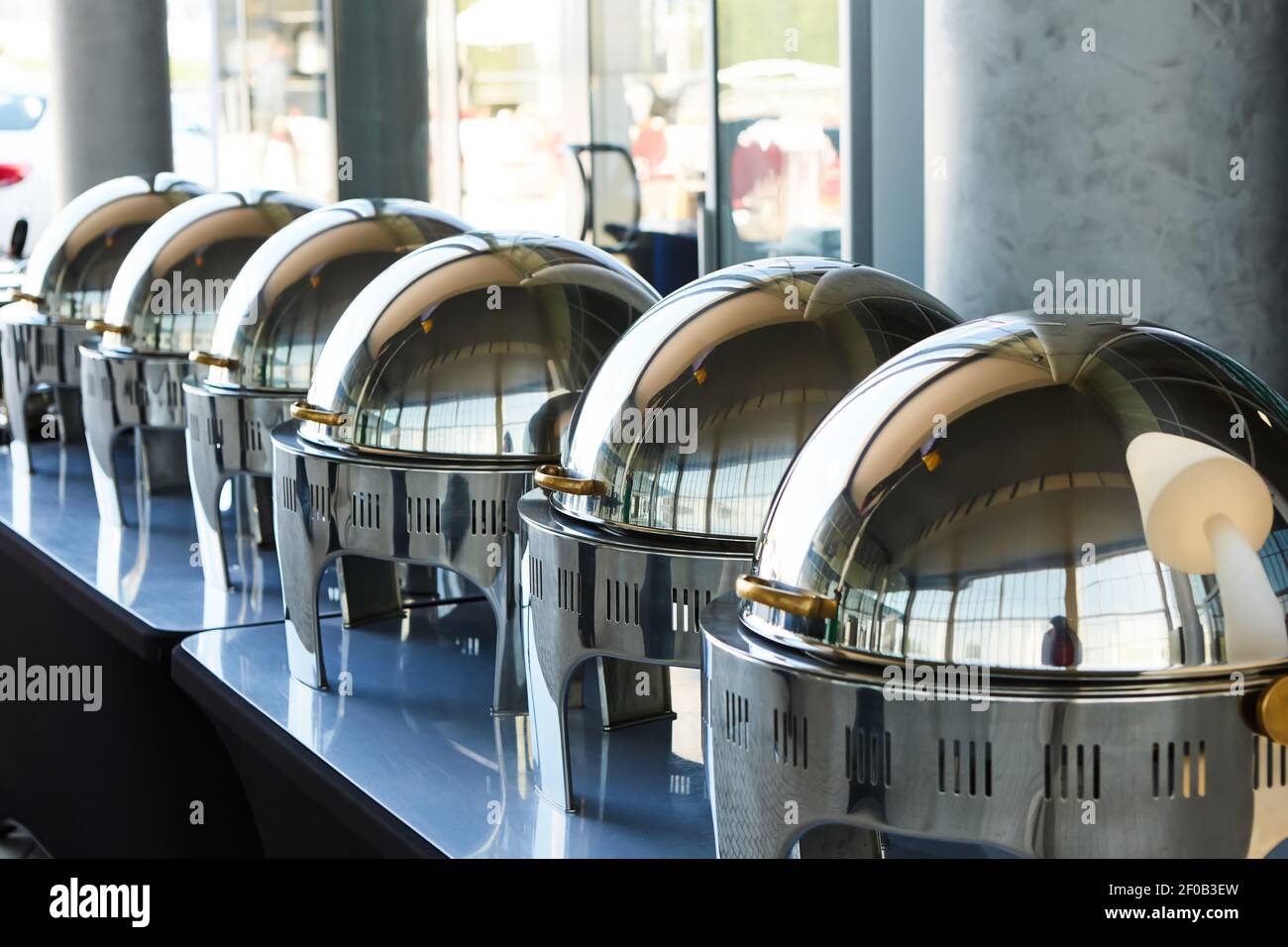 Buffet Table with Row of Food Service Steam Pans Stock Photo