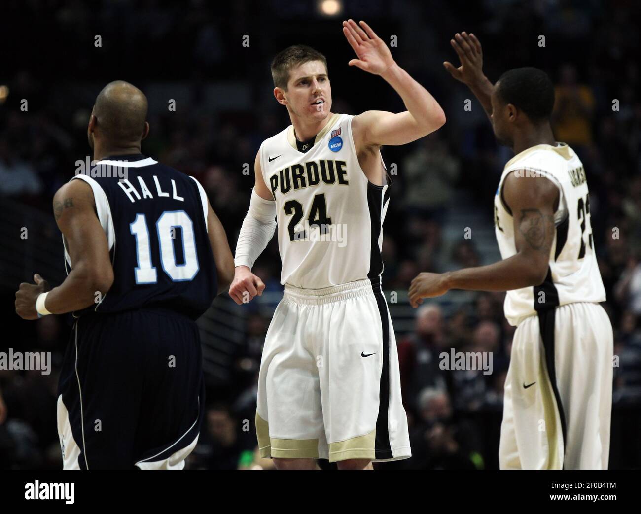 Purdue guard Ryne Smith (24) congratulates teammate Lewis Jackson, right,  during the second half against St. Peter's in the second round of the 2011  NCAA Men's Basketball Championship at the United Center