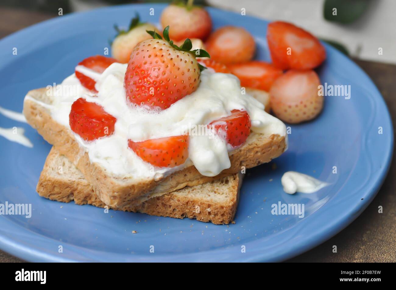bread, toast with whipped cream and strawberry topping Stock Photo Alamy