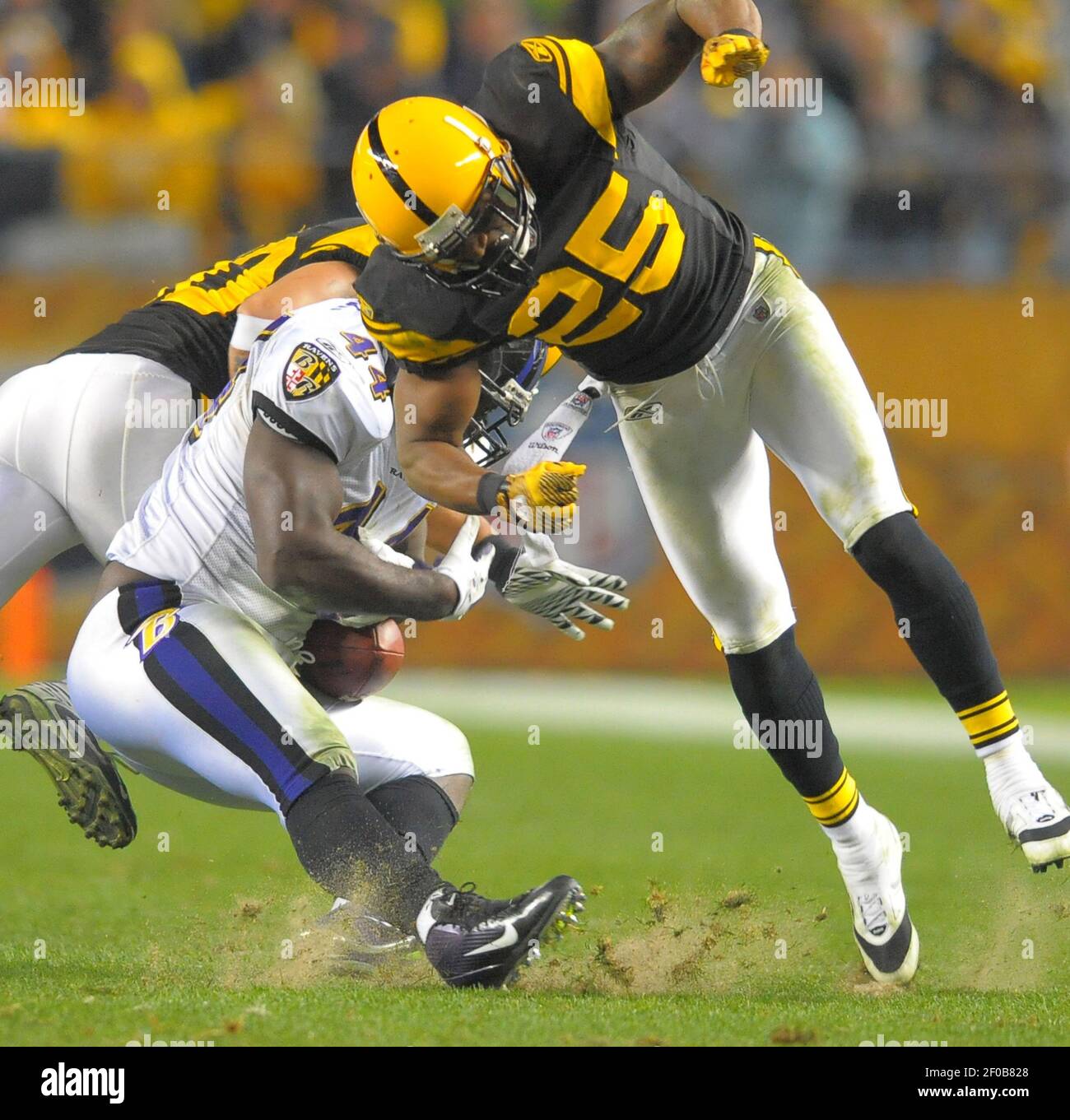 Pittsburgh Steelers free safety Ryan Clark and linebacker Larry Foote make  a simultaneous hit on Baltimore Ravens fullback Vonta Leach after Leach  makes a first down reception during the second half of