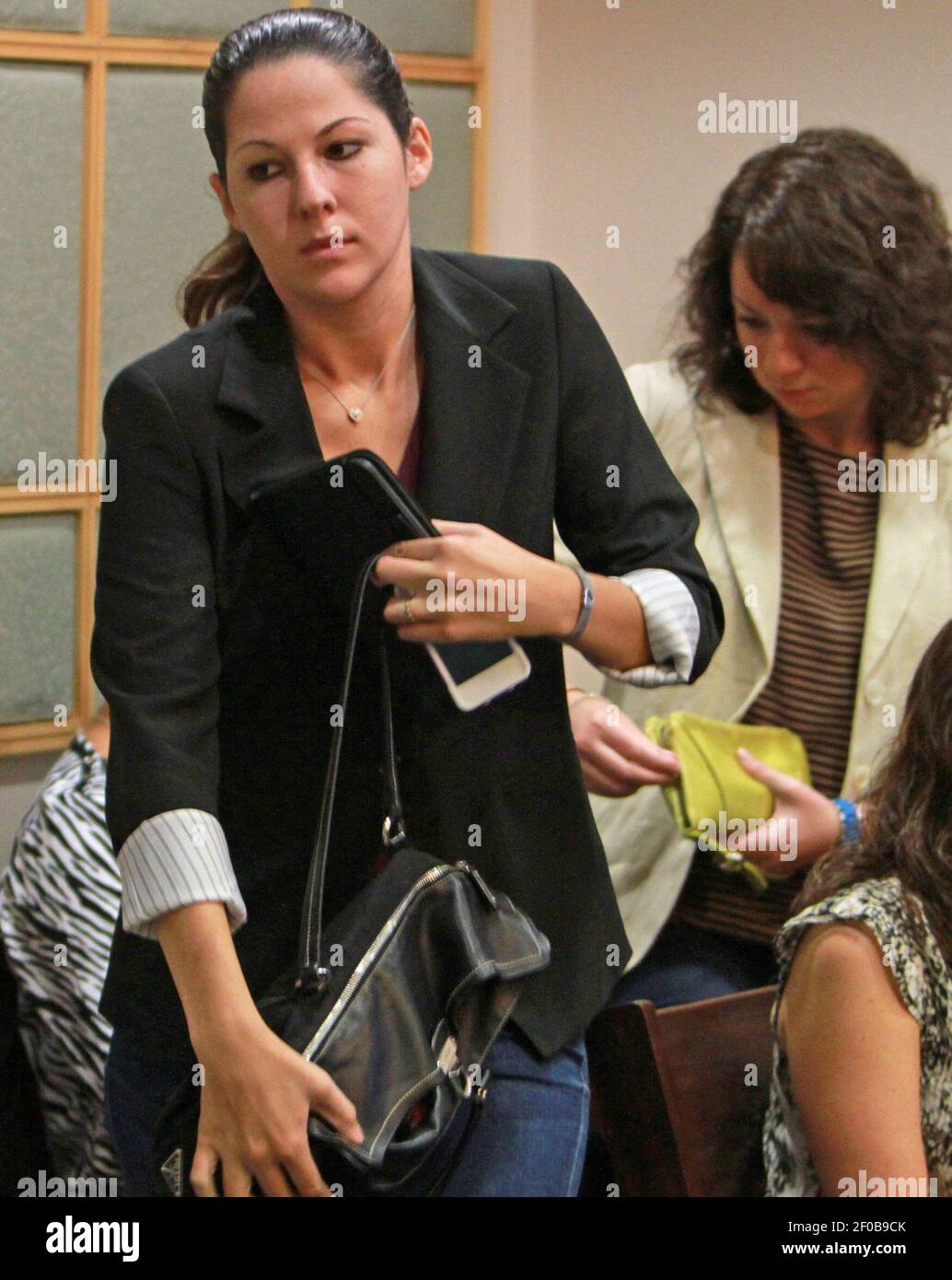 Sarah, left, and Mallory Ward leave the courtroom Thursday, September