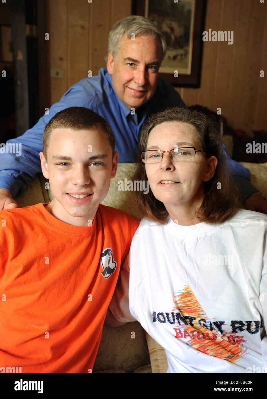 Grayson Gilbert, 21, left, is pictured in his Towson, Maryland home ...