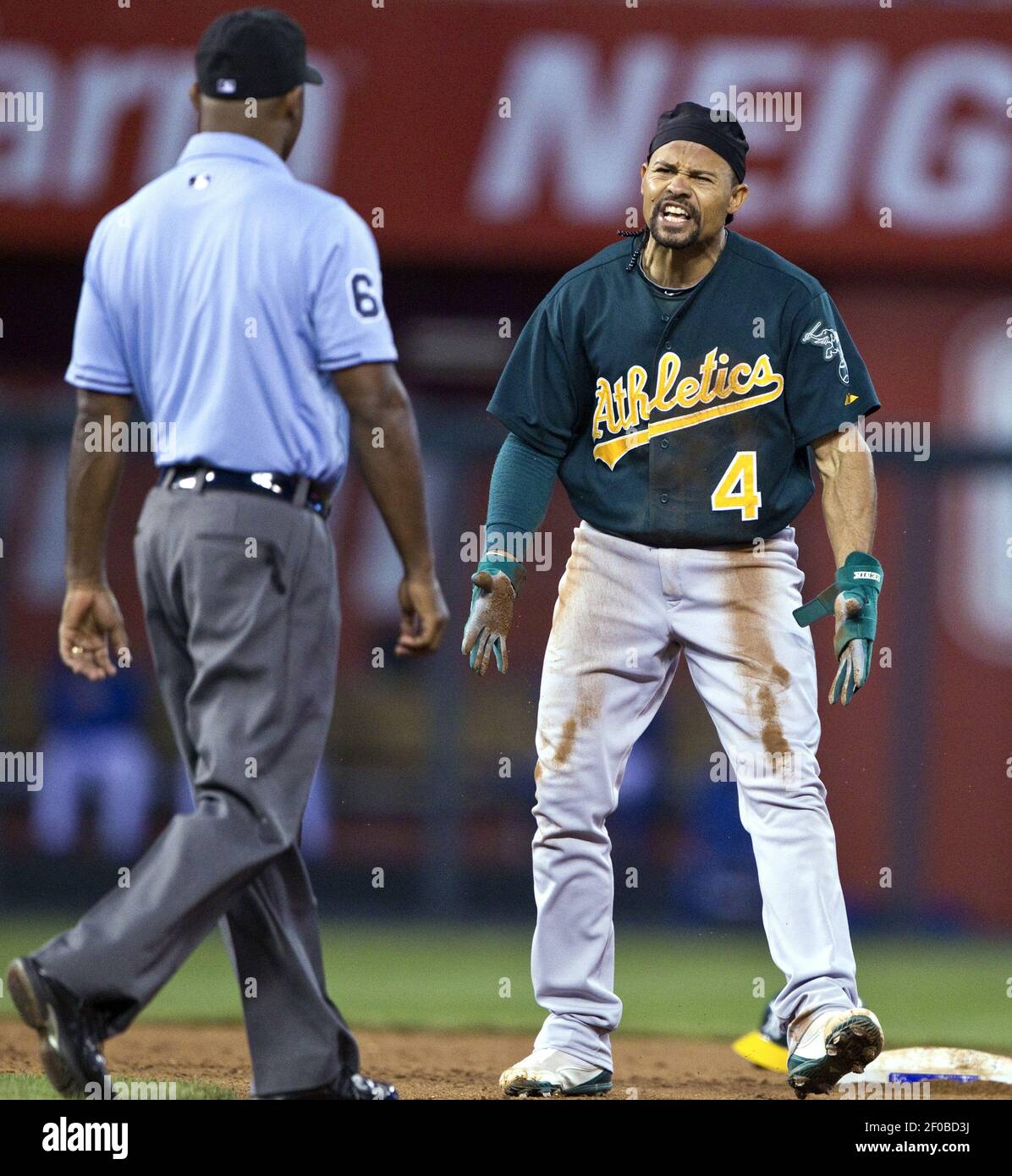 The Oakland Athletics Coco Crisp 4 Complains To Second Base Umpire Alan Porter After Being Called Out Trying To Steal Second In The Fifth Inning Against The Kansas City Royals At Kauffman