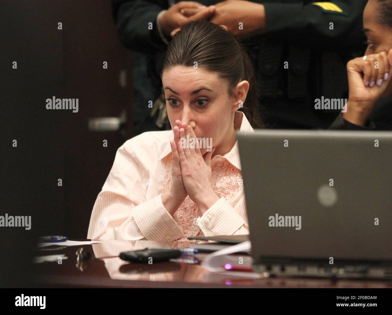 Casey Anthony reacts during testimony by her father George Anthony ...