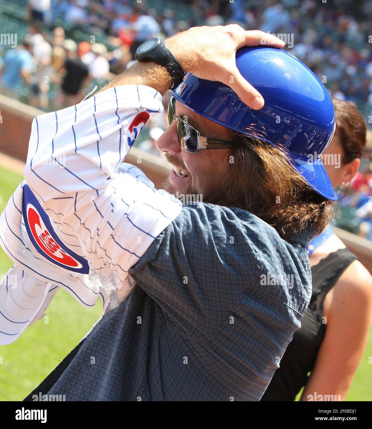 Pearl Jam frontman Eddie Vedder tries on a Chicago Cubs jersey as