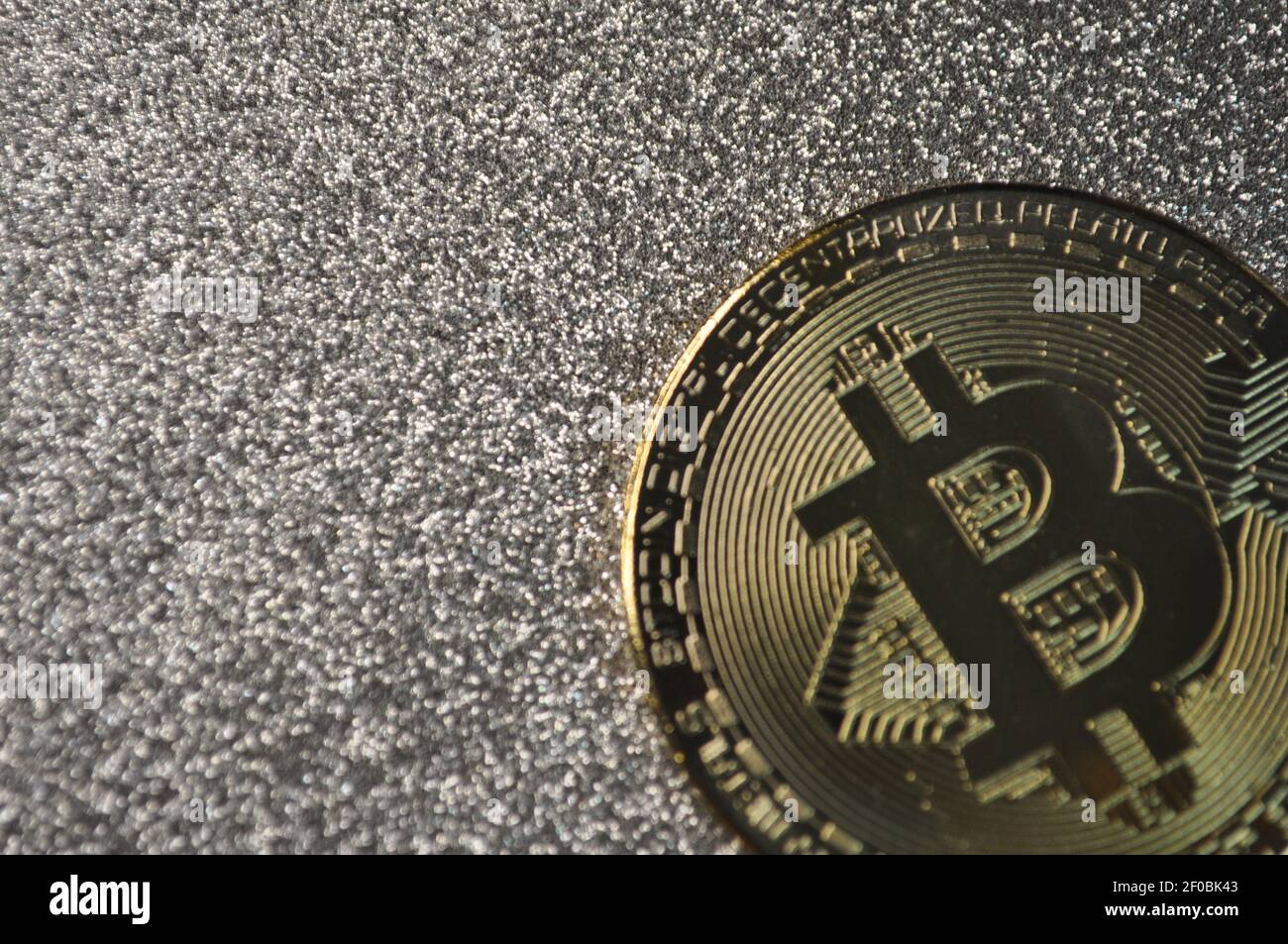 Silver Color Bitcoin Macro view of gold and silver color shiny coins with Bitcoin symbol ...