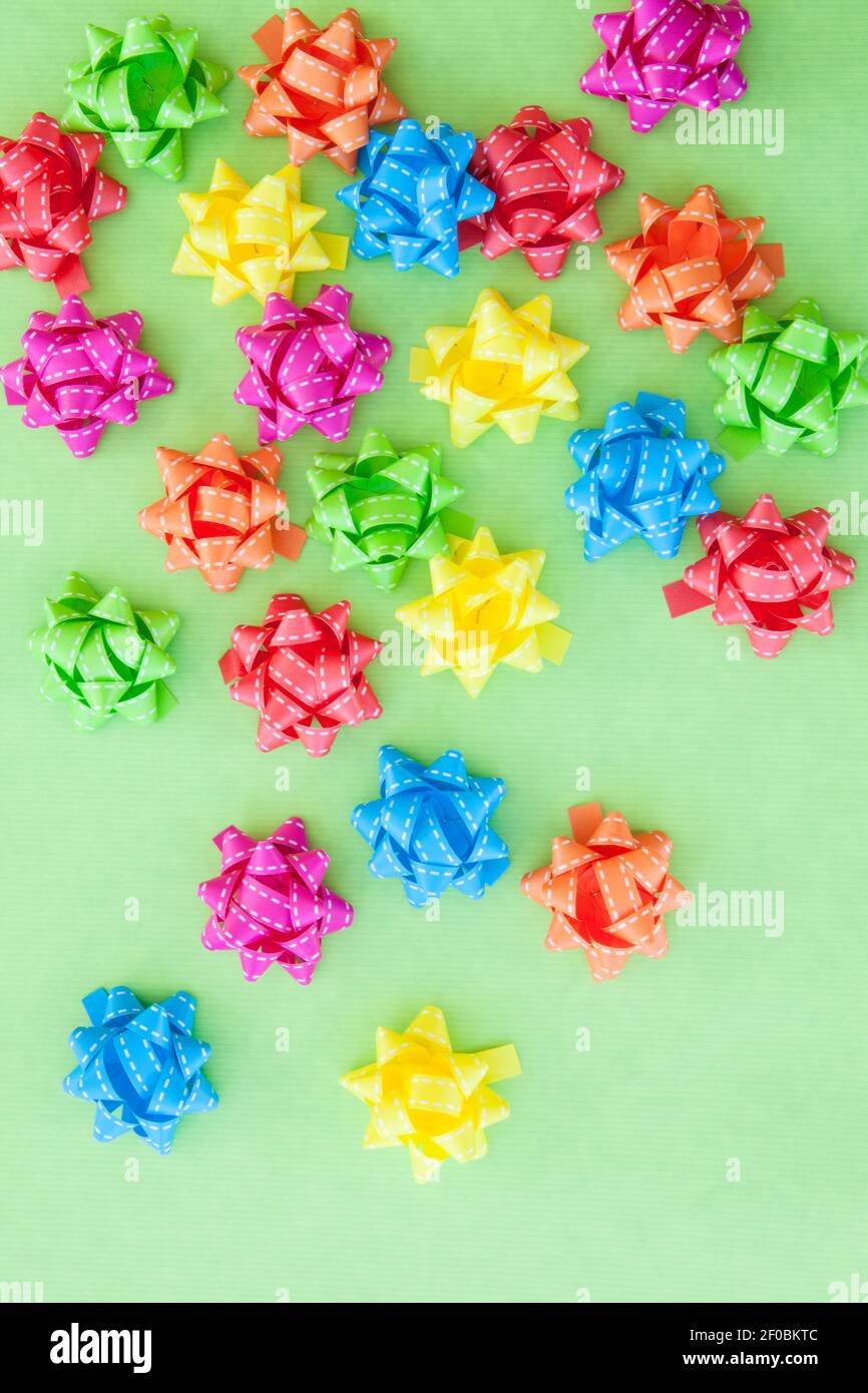 Colorful bows on green Stock Photo