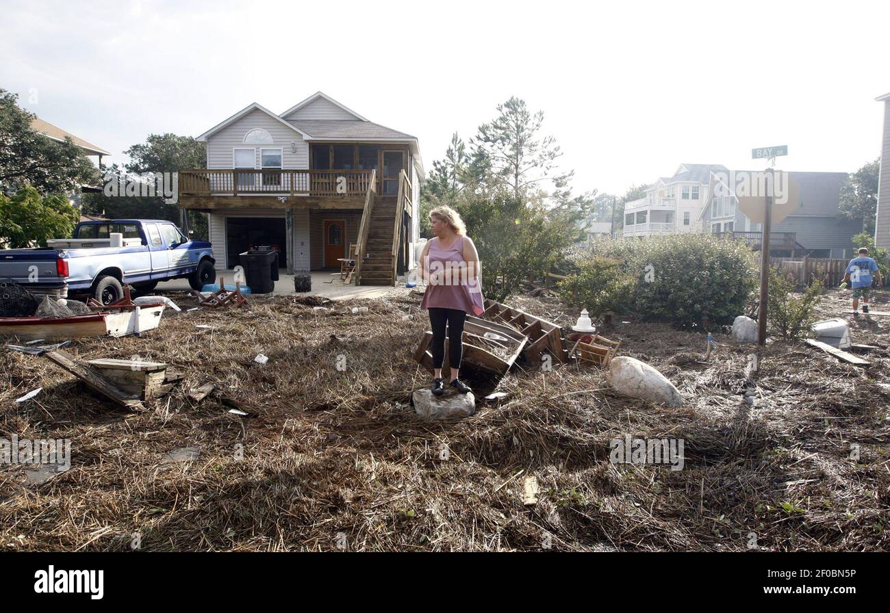 Shari Compton looks over the devastation after Hurricane Irene passed ...
