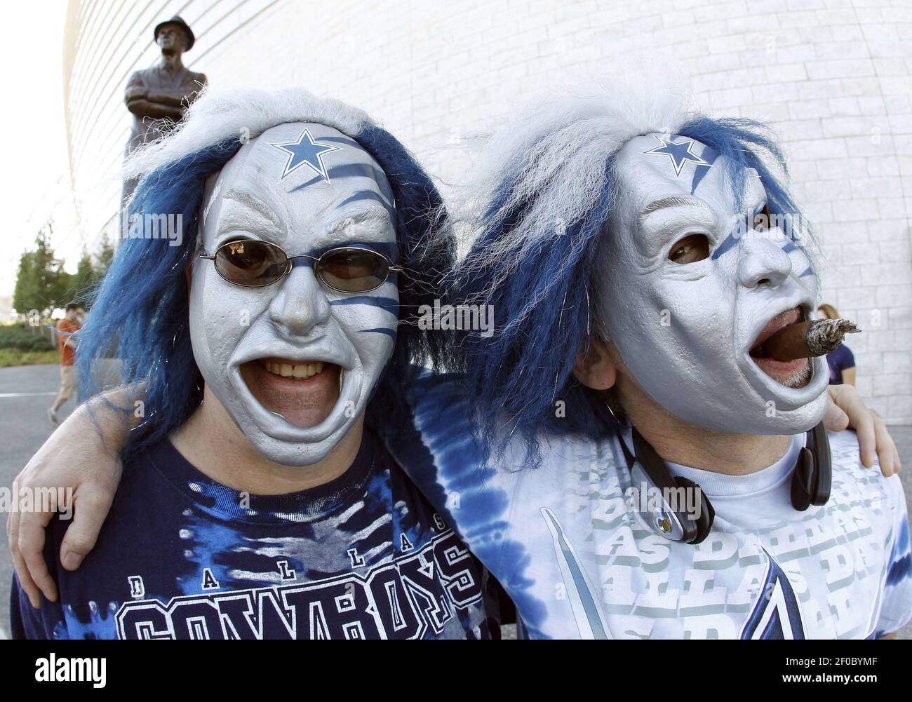 Dallas Cowboy fans Walter Rubacha and Rene Leveille came from Conneticute for the game, posing in their blue and silver Halloween masks near Tom Landry's statue outside Cowboys Stadium in Arlington, Texas, Sunday, October 2, 2011. The Detroit Lions defeated the Cowboys, 34-30. (Photo by Paul Moseley/Fort Worth Star-Telegram/MCT/Sipa USA) Stock Photo