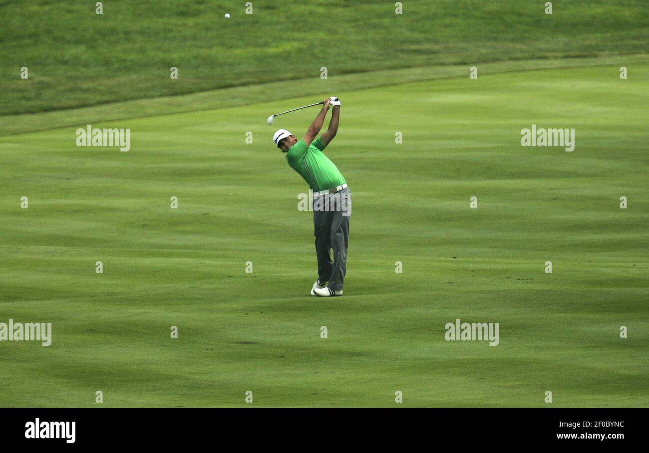 Jason Day hits his second shot on the 10th hole during third round play ...