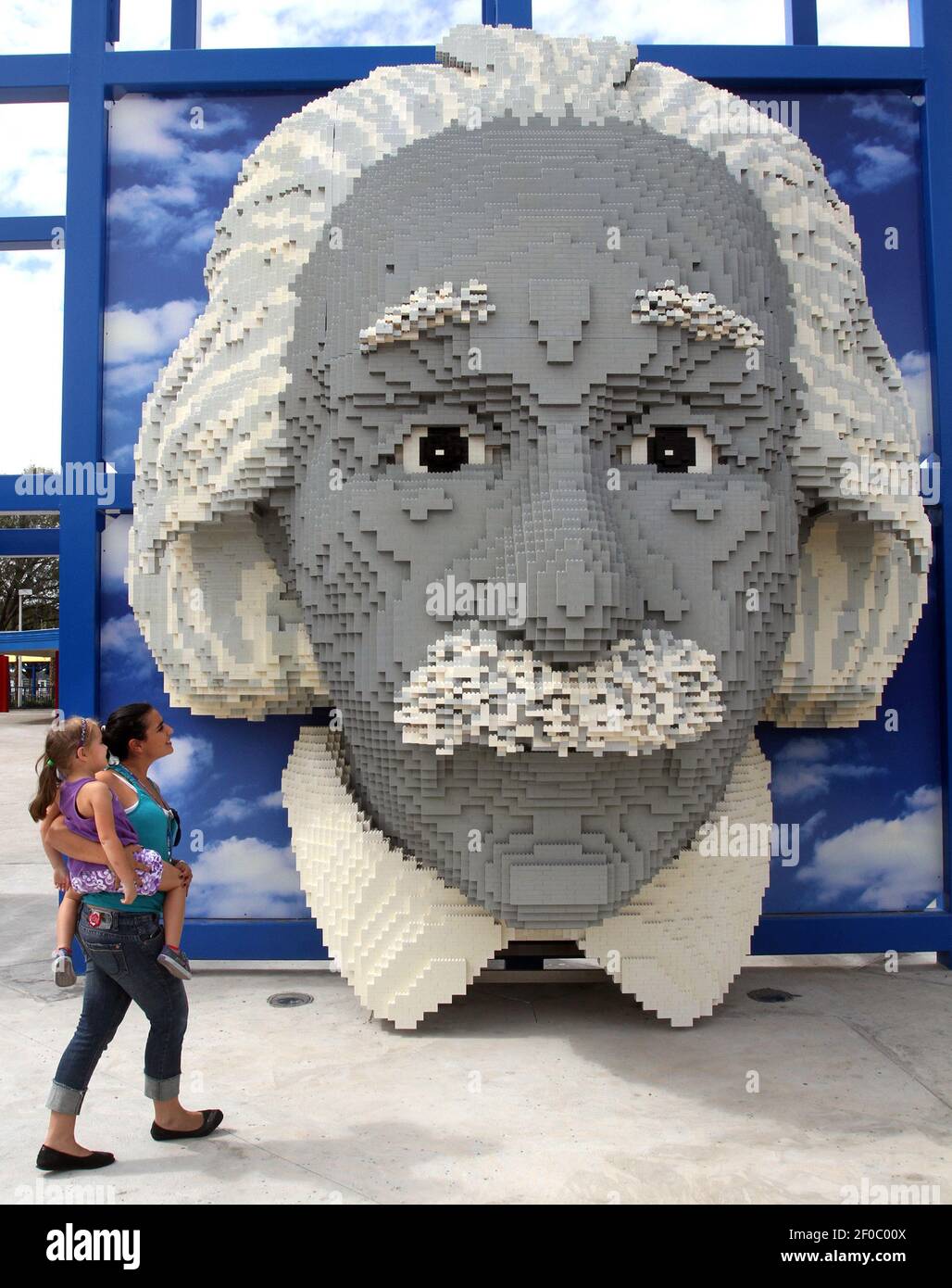 Luciana Mino of Orlando, with her stepdaughter Ava Hazard, 5, check out the largest  Lego sculpture in the park, an Albert Einstein sculpture, during a preview  of Legoland Florida as a part