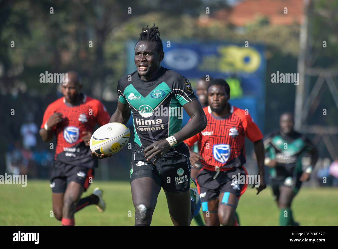 Kampala, Uganda. 6th Mar, 2021. Aaron Ofoywroth (front) of Heathens competes during the first Uganda rugby premier league match between Pirates and Heathens at Kyadondo rugby grounds in Kampala, capital of Uganda, March 6, 2021. Credit: Hajarah Nalwadda/Xinhua/Alamy Live News Stock Photo