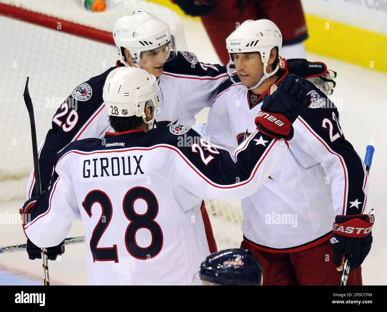 Columbus Blue Jackets defenseman Nick Blankenburg, left, controls the puck  behind Toronto Maple Leafs defenseman Justin Holl during an NHL hockey game  in Columbus, Ohio, Friday, Feb. 10, 2023. The Maple Leafs