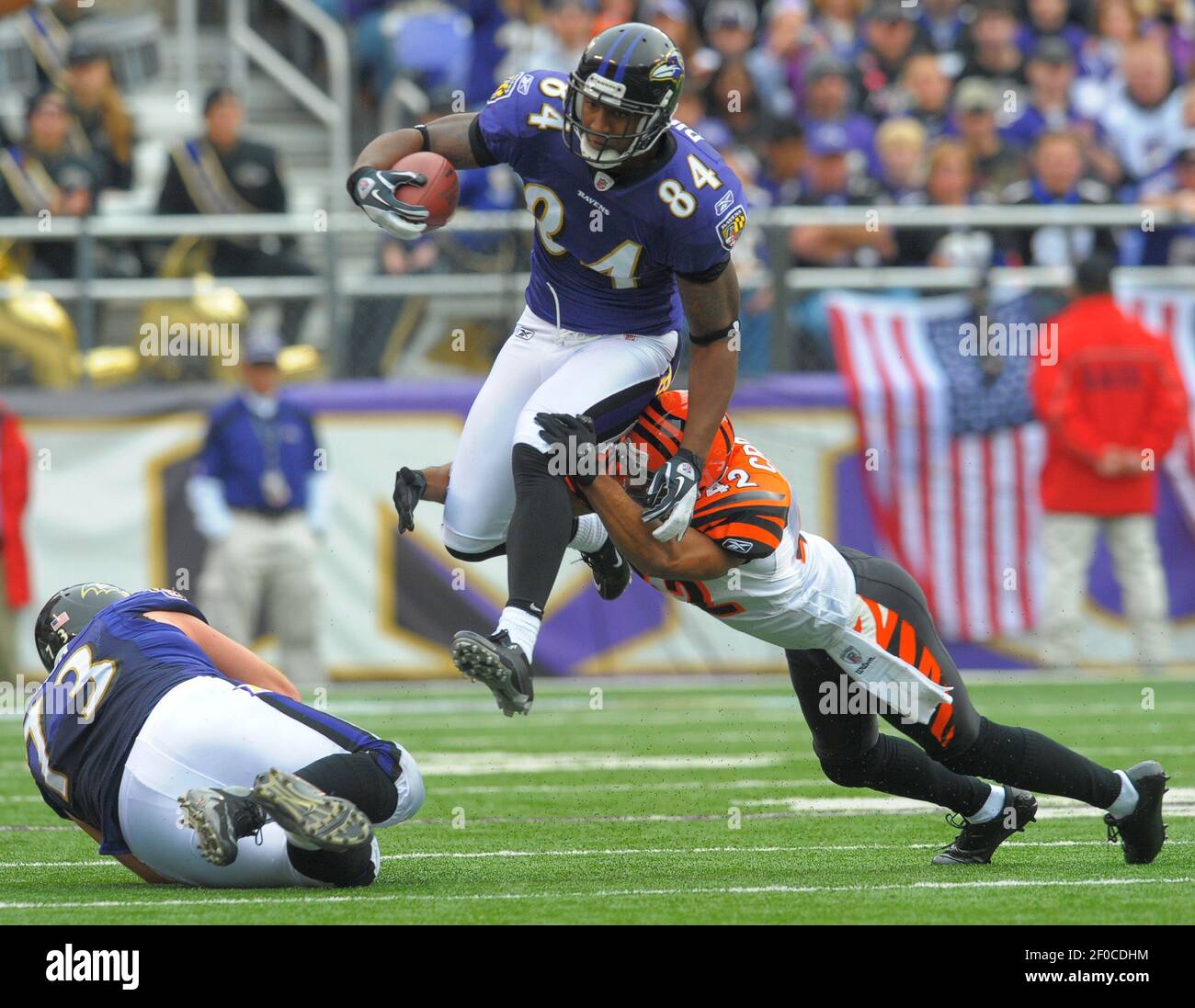 Baltimore Ravens tight end Ed Dickson attempts to leap past the tackle  attempt of Cincinnati Bengals strong safety Chris Crocker but still comes  up short of a first down in the first
