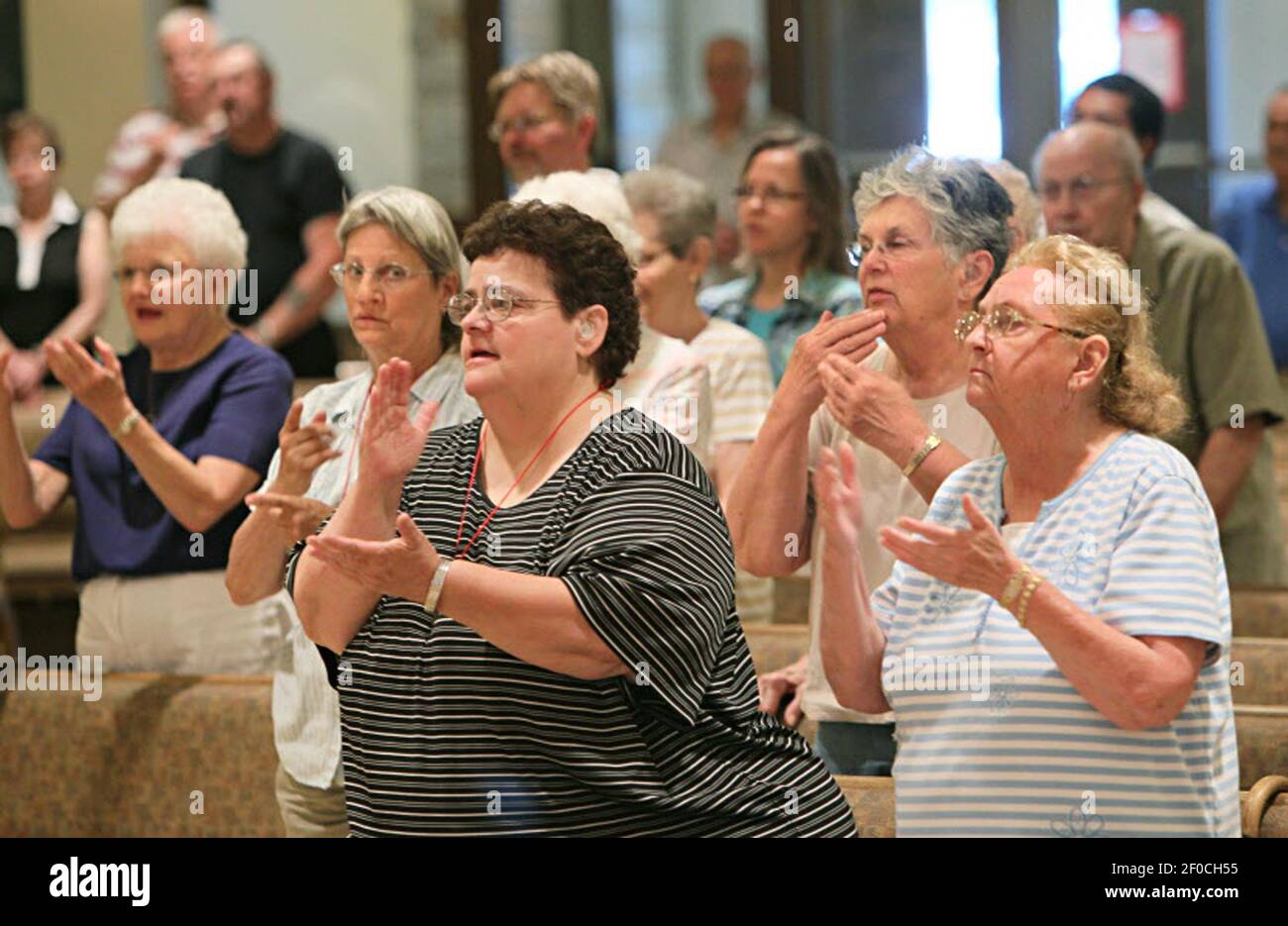 The hearing impaired recite a prayer using American Sign Language at St ...