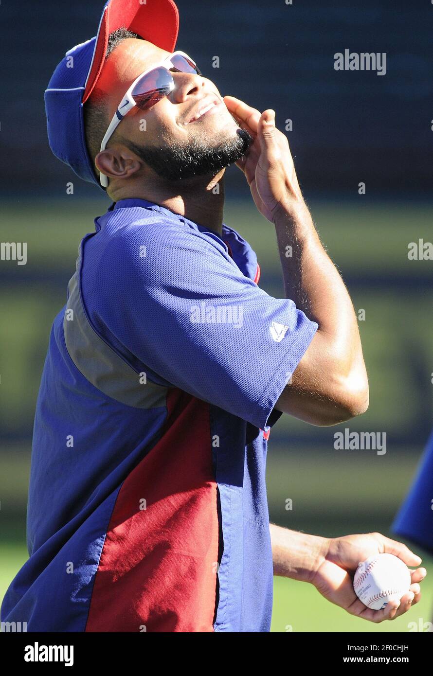 The Texas Rangers' Elvis Andrus shows off his beard to teammates durin a  workout for Game 6 of the American League Championship Series against the  Detroit Tigers at Rangers Ballpark in Arlington