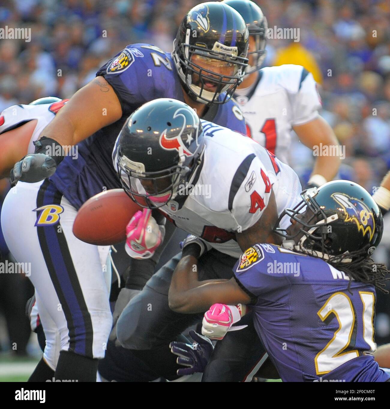 Baltimore Ravens cornerback Lardarius b (21) forces a fumble near