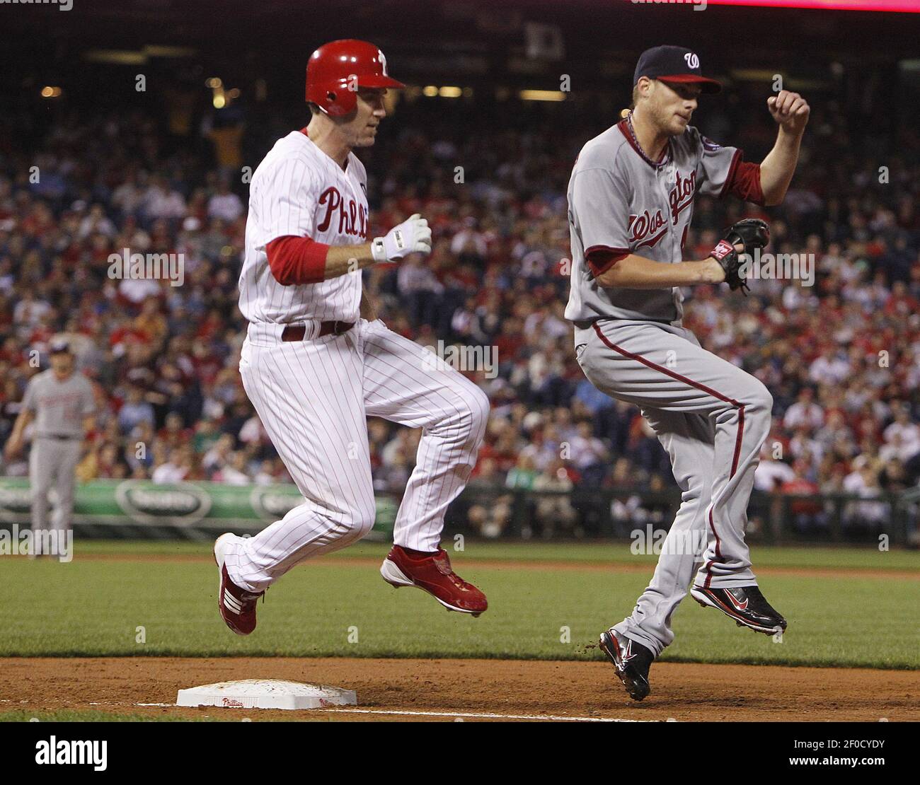 Philadelphia Phillies Chase Utley is out at first, as Washington Nationals pitcher Ross Detwiler takes the throw from first baseman Chris Marrero in the second inning during Game 2 of a doubleheader at Citizens Bank Park in Philadelphia, Pennsylvania on Tuesday, September 20, 2011. (Photo by Ron Cortes/Philadelphia Inquirer/MCT/Sipa USA) Stock Photo