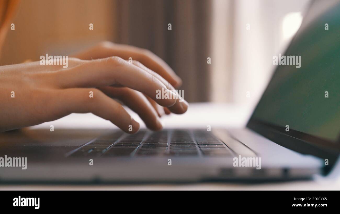 typing on laptop keyboard internet close-up work communication Stock