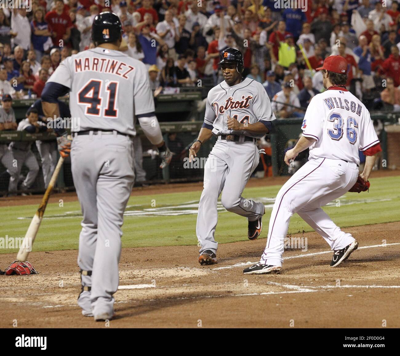 Detroit Tigers Austin Jackson Middle Scores On A Wild Pitch In The Fifth Inning In Front Of Texas Rangers Starting Pitcher C J Wilson 36 In Game 1 Of The American League Championship Detroit Tigers Austin Jackson Middle Scores On A Wild Pitch In The Fifth Inning In Front Of Texas Rangers Starting Pitcher C J Wilson 36 In Game 1 Of The American League Championship