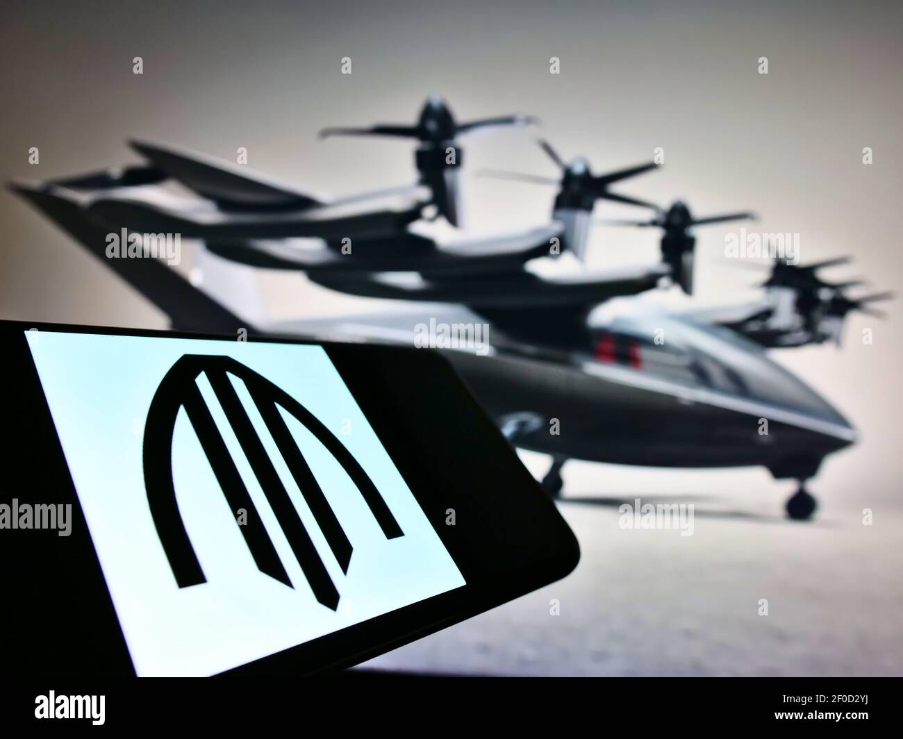 Smartphone with business logo of US air taxi company Archer Aviation on screen in front of website. Focus on center of phone display. Unmodified photo. Stock Photo