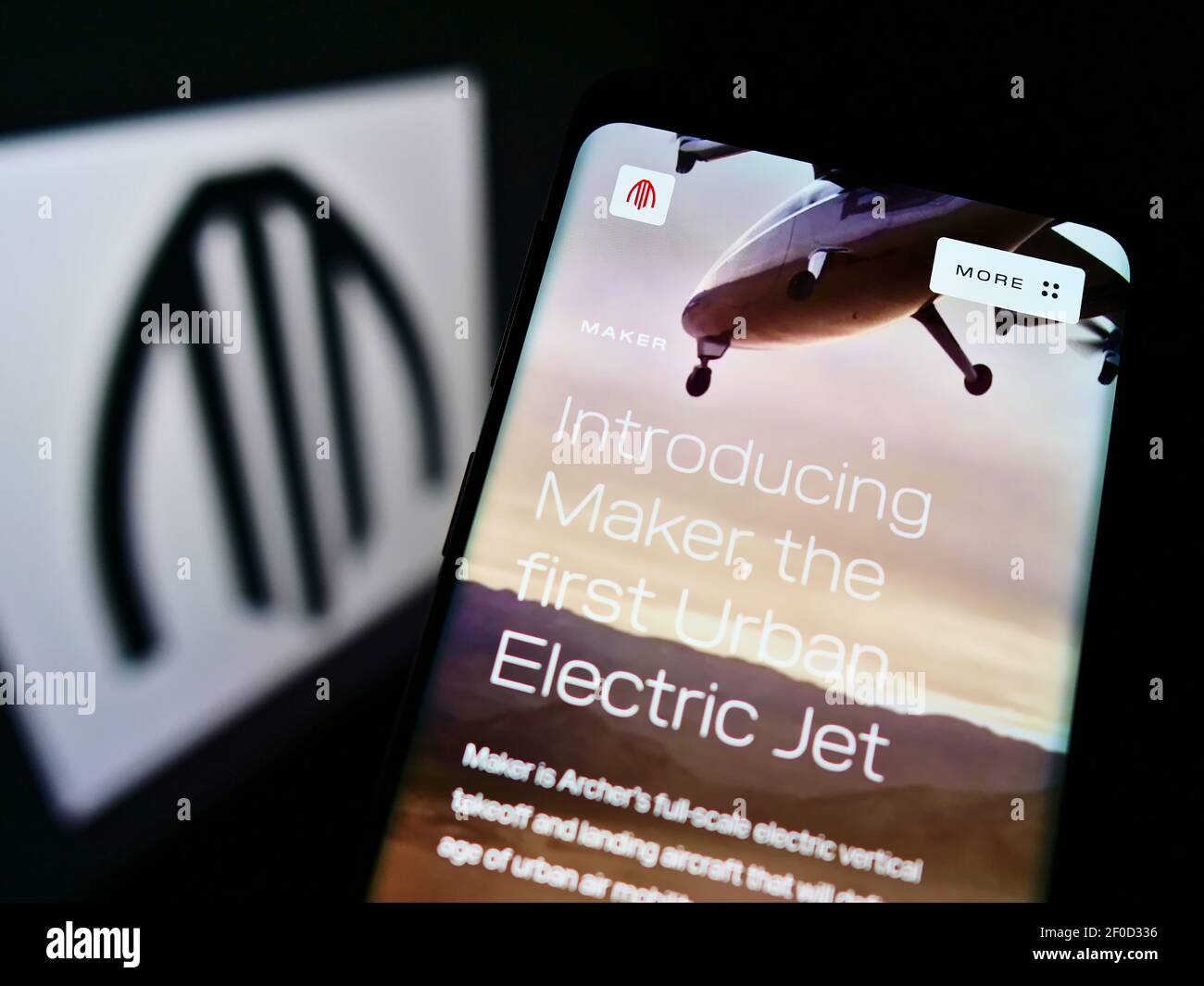 Cellphone with business website of American air taxi company Archer Aviation on screen in front of logo. Focus on top-center of phone display. Stock Photo