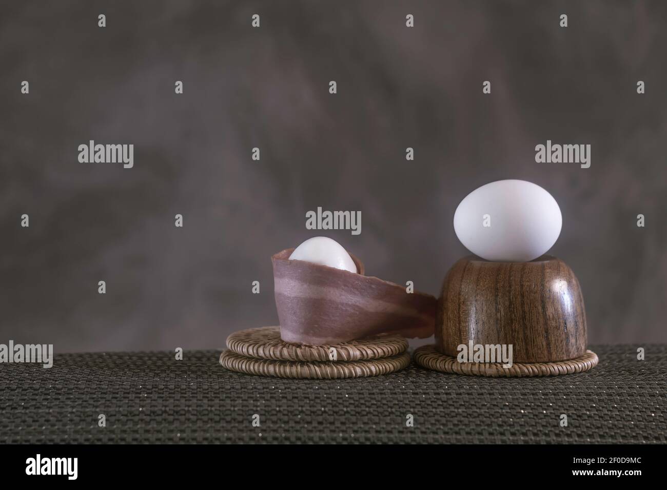 Turkey bacon wrapped around a chicken egg Stock Photo Alamy