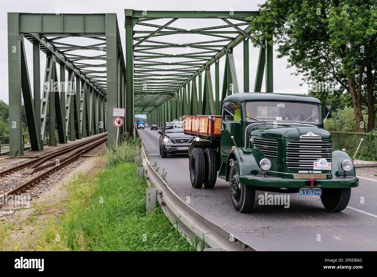 mauthausen, austria, 01 sep 2017, steyr vintage flatbed truck crossing the danube bridge in mauthausen at the oldtimer truck meeting, meeting for vint Stock Photo