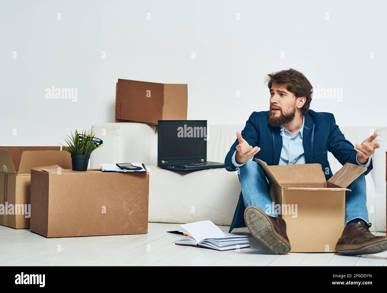 Business man getting laid off packing things manager Stock Photo - Alamy