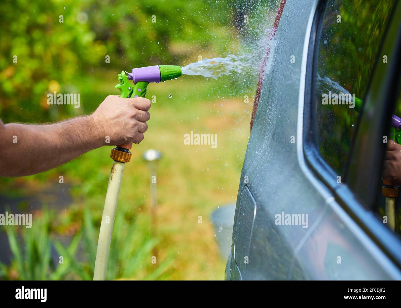 People cleaning car using high pressure water Stock Photo Alamy