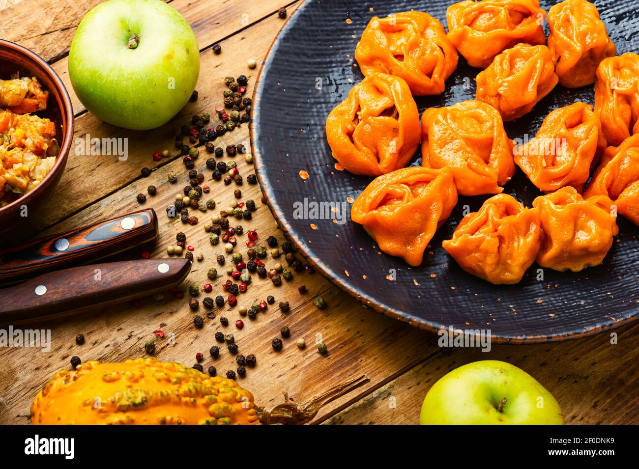 Steamed dumplings or manti with pumpkin.Traditional autumn dish Stock