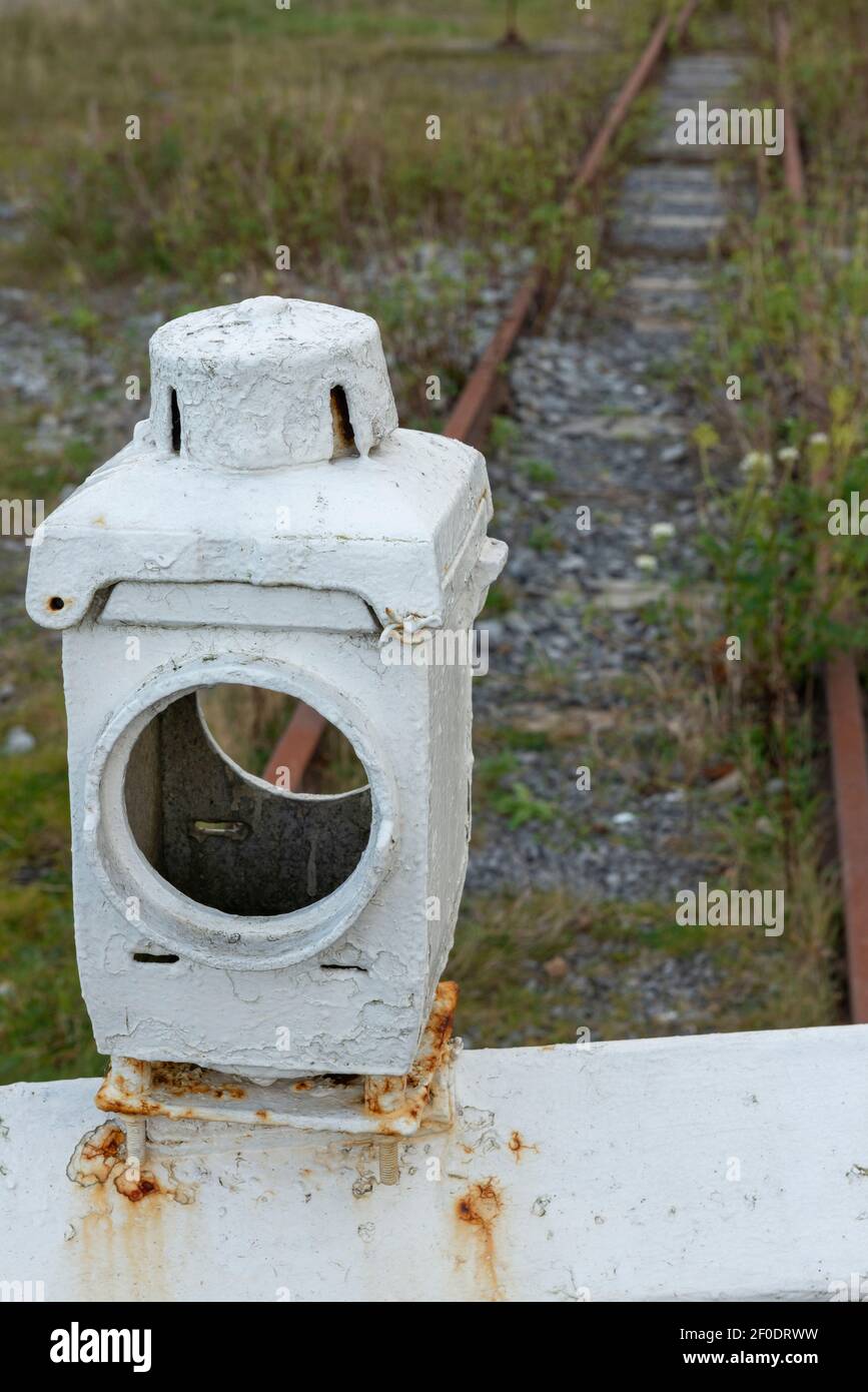 Antique vintage disused railway signal box lamp at abandoned railroad. Stock Photo