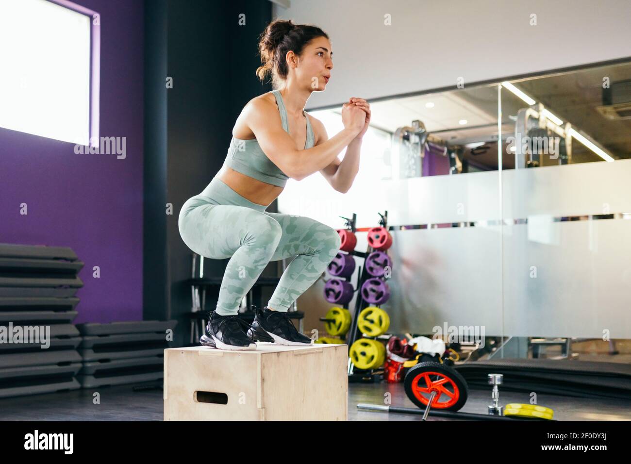 Caucasian female doing box jump workout at gym Stock Photo Alamy