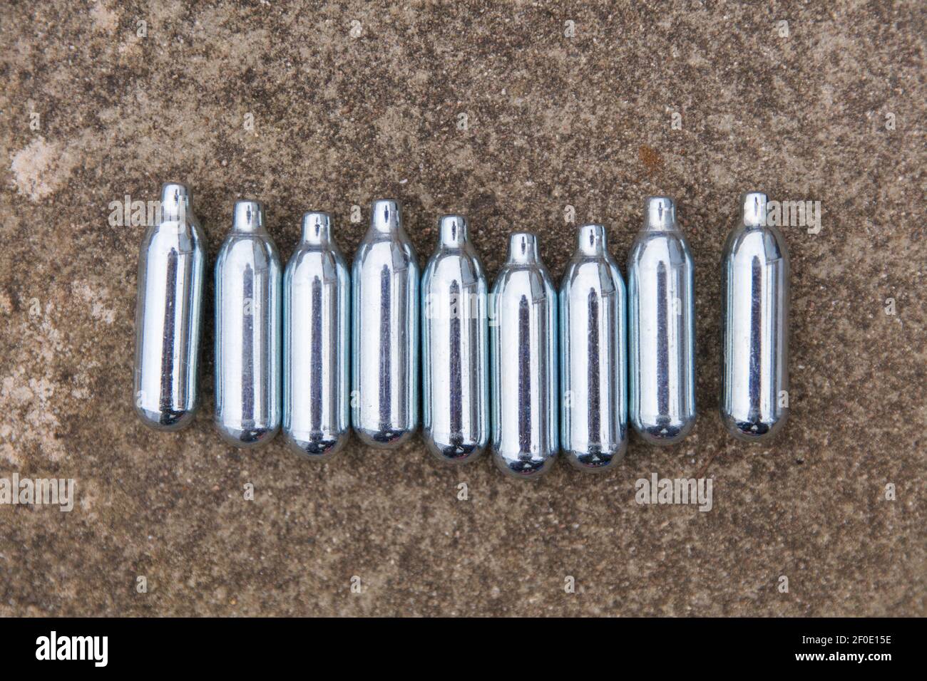 Nitrous oxide metal bulbs or laughing gas recreational drug use Stock Photo