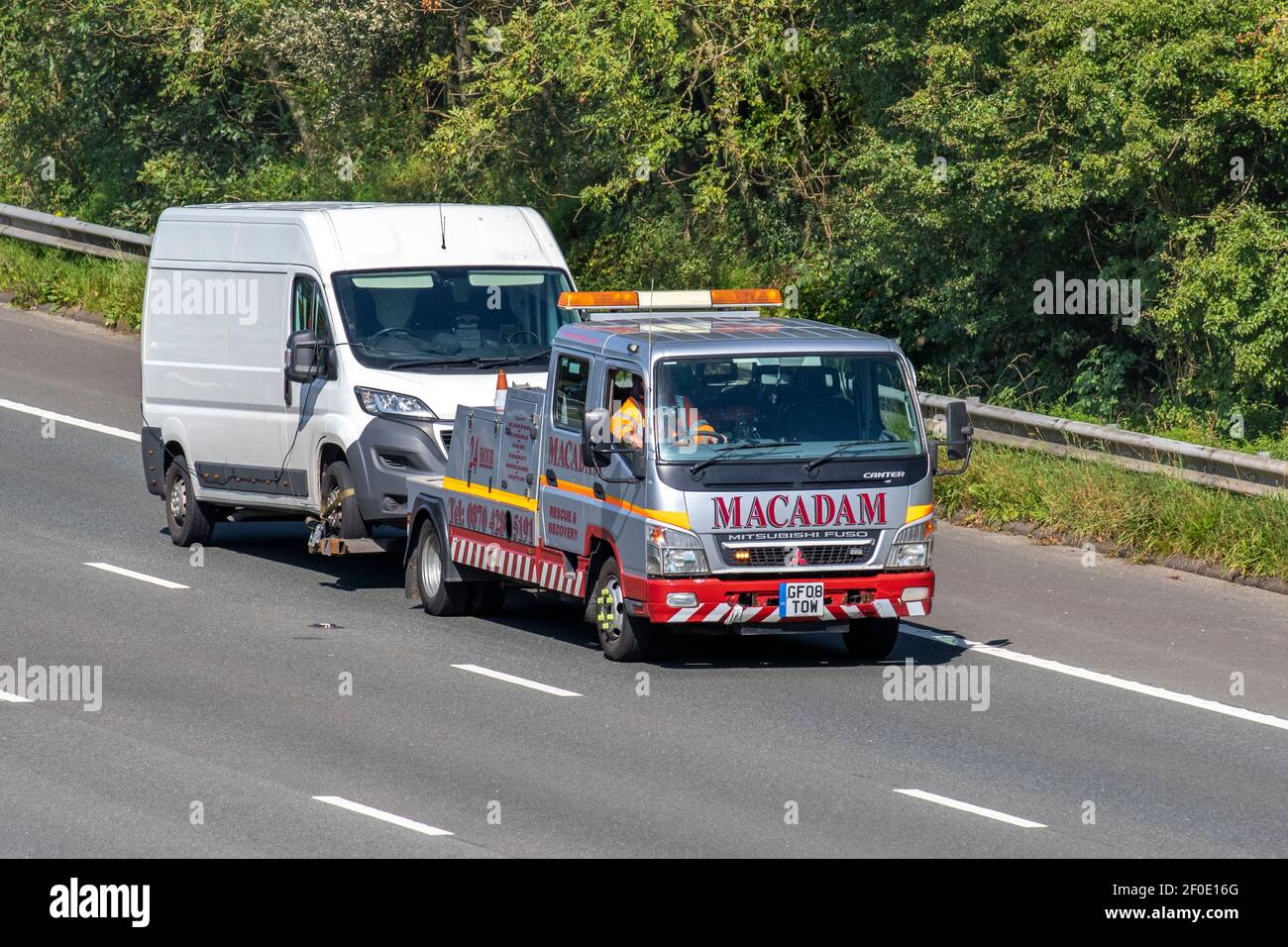 Macadam Canter Rescue and recovery; Auto transporter, car transporter carrier; Motorway heavy bulk Haulage delivery trucks, haulage, 2008 Mitsubishi Fuso lorry, transportation, collection and deliveries, multi-car commercial vehicle carrier, truck UK Stock Photo