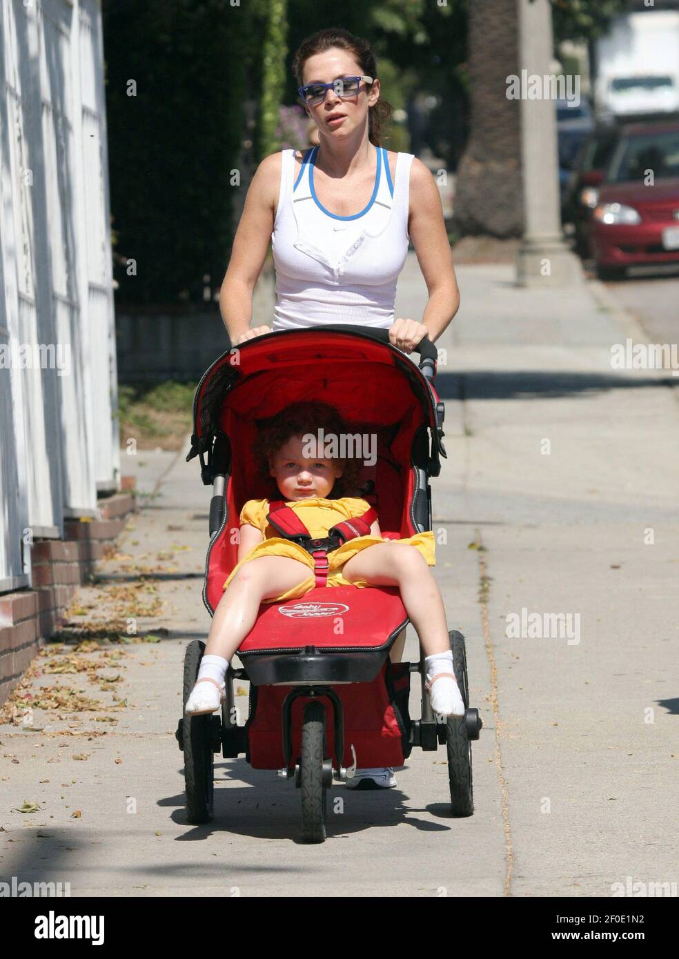 LOS ANGELES: Anna Friel the star of USA comedy Pushing Daisies looks great as she jogs while pushing baby Gracie in the Hollywood Hills. British actress Anna was joined by a friend as they pounded the streets under the Californian sun on Thursday 9th October in Los Angeles. Stock Photo