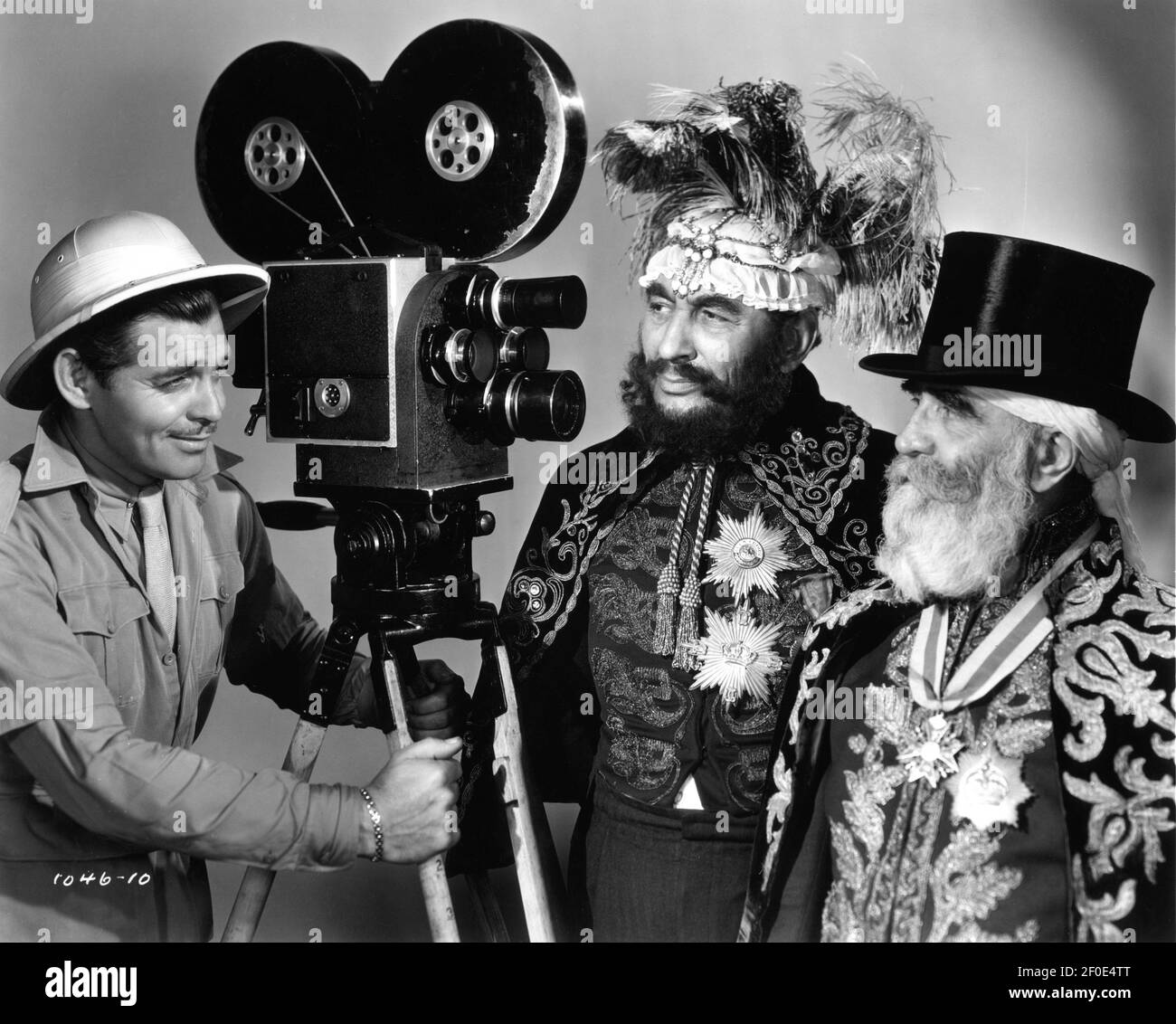 CLARK GABLE Publicity Portrait with Newsreel Movie Camera and 2 Exotically  Dressed Men for TOO HOT TO HANDLE 1938 director JACK CONWAY based on a  story by Len Hammond screenplay Laurence Stallings