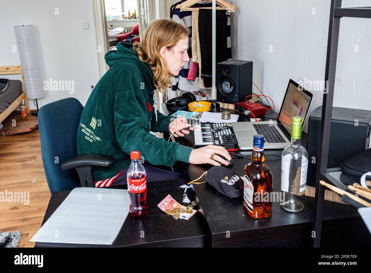 Berlin, Netherlands. Young Bimm Academy Student producing his urban music inside his small Friedrichshain apartment. Stock Photo