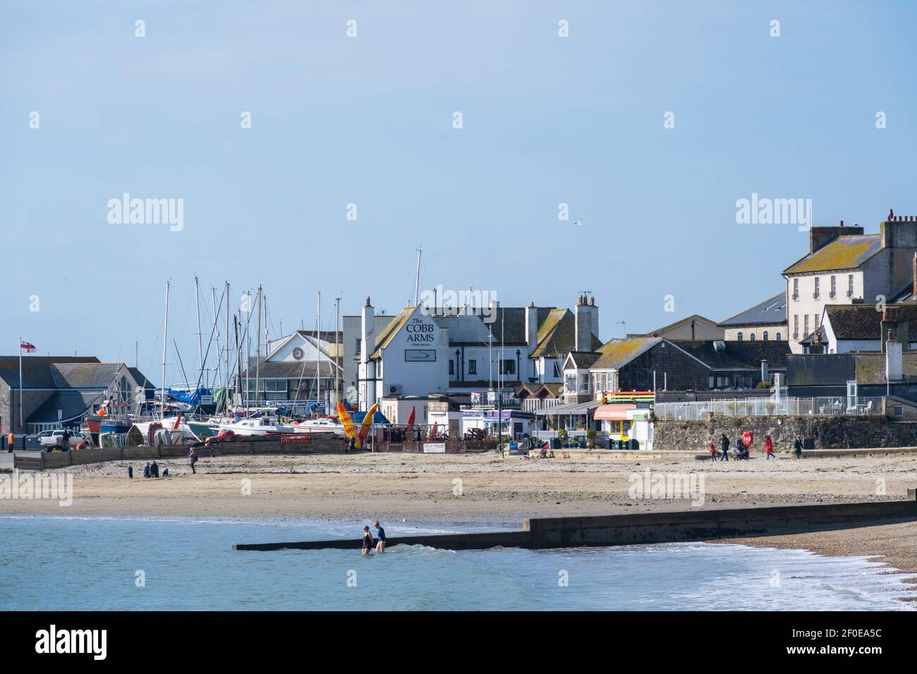 Lyme Regis, Dorset, UK. 7th March 2021. UK Weather: The picturesque seaside town of Lyme Regis on a glorious spring day during the third national lockdown. The beach would normally be much busier on a sunny Sunday in early spring. Credit: Celia McMahon/Alamy Live News. Stock Photo
