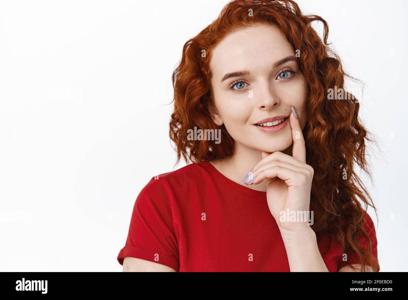 Close Up Portrait Of Beautiful Redhead Female Model With Long Curly