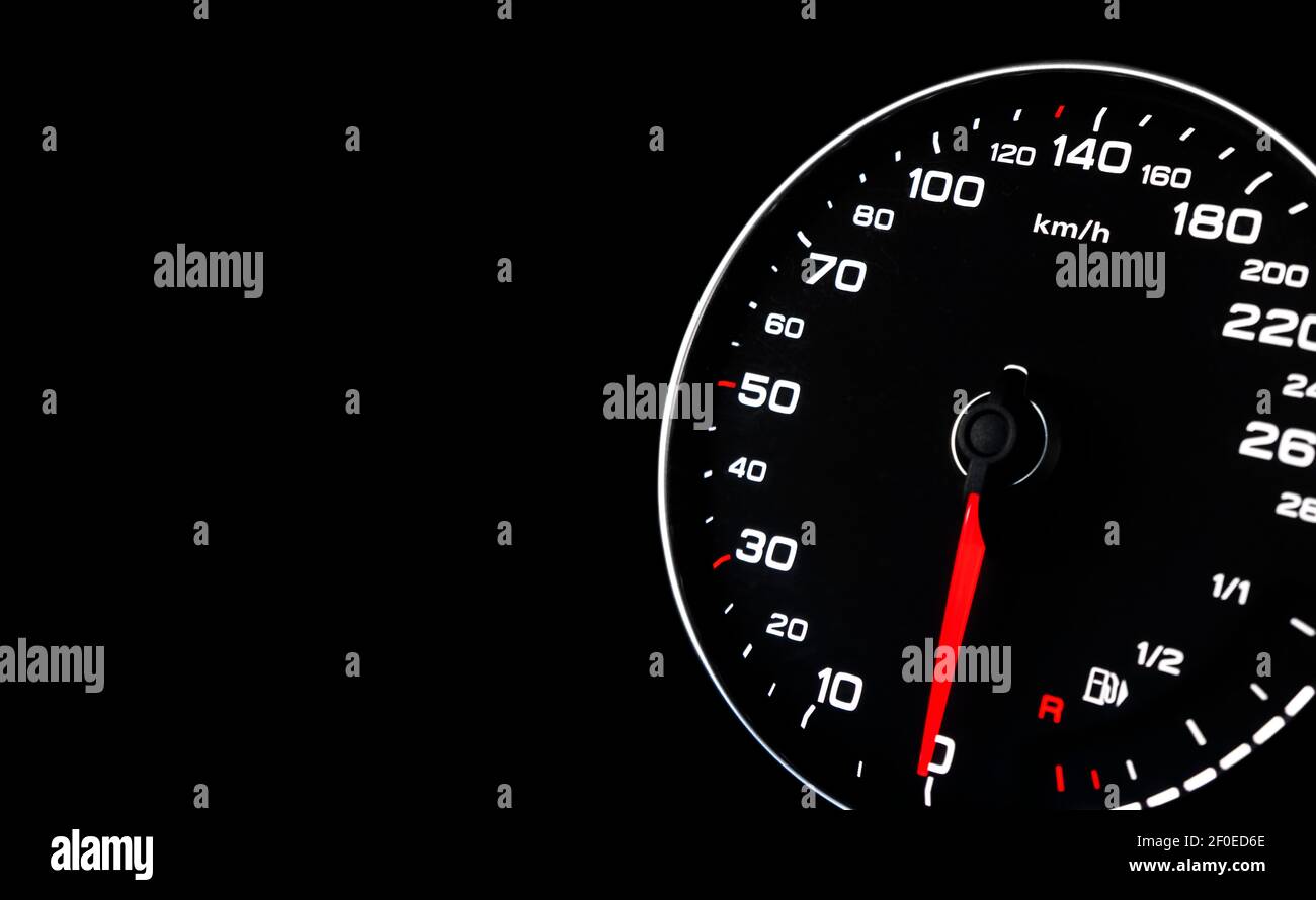 Close up shot of a speedometer in a car. Car dashboard. Dashboard details with indication lamps