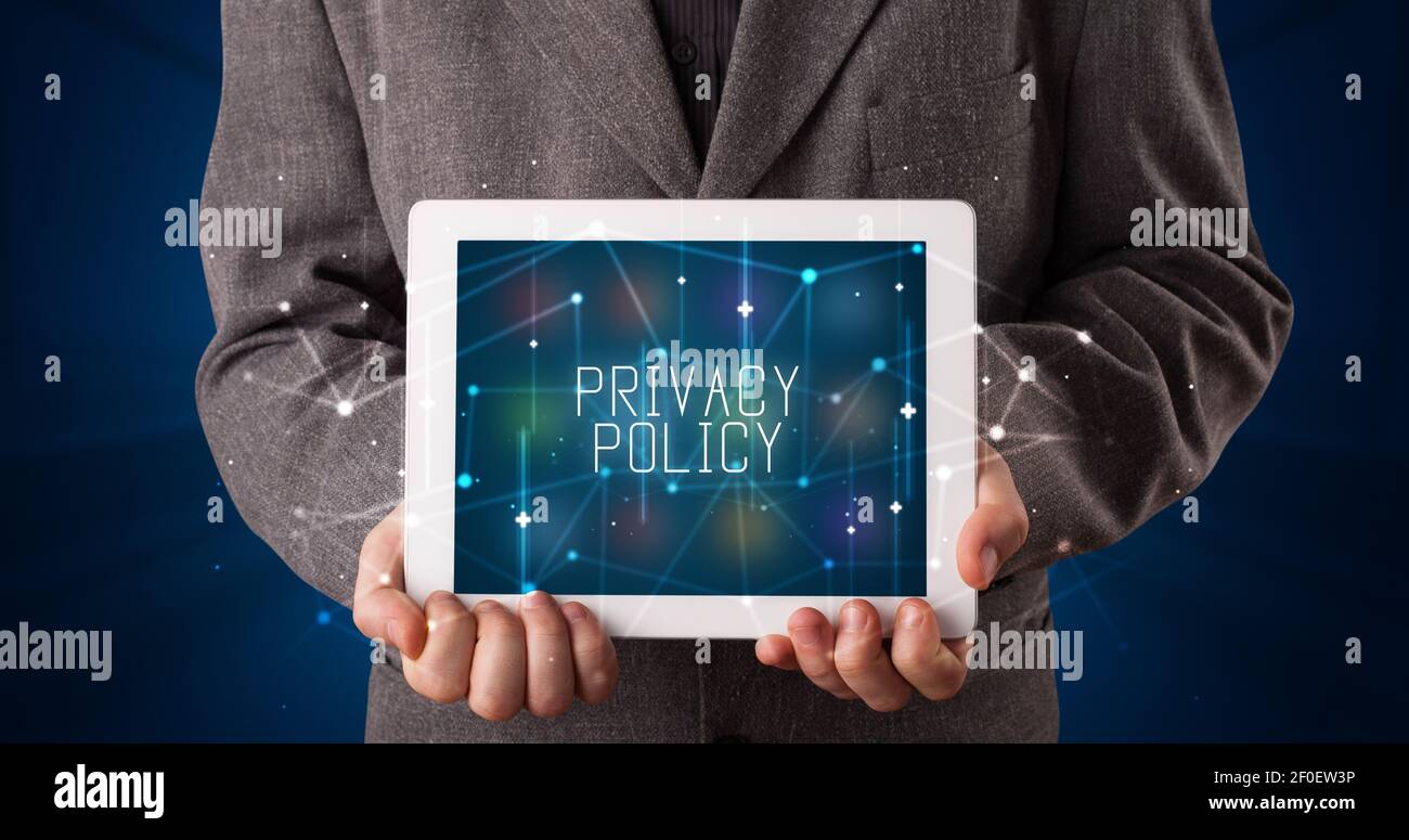 Young business person working on tablet and shows the digital sign ...