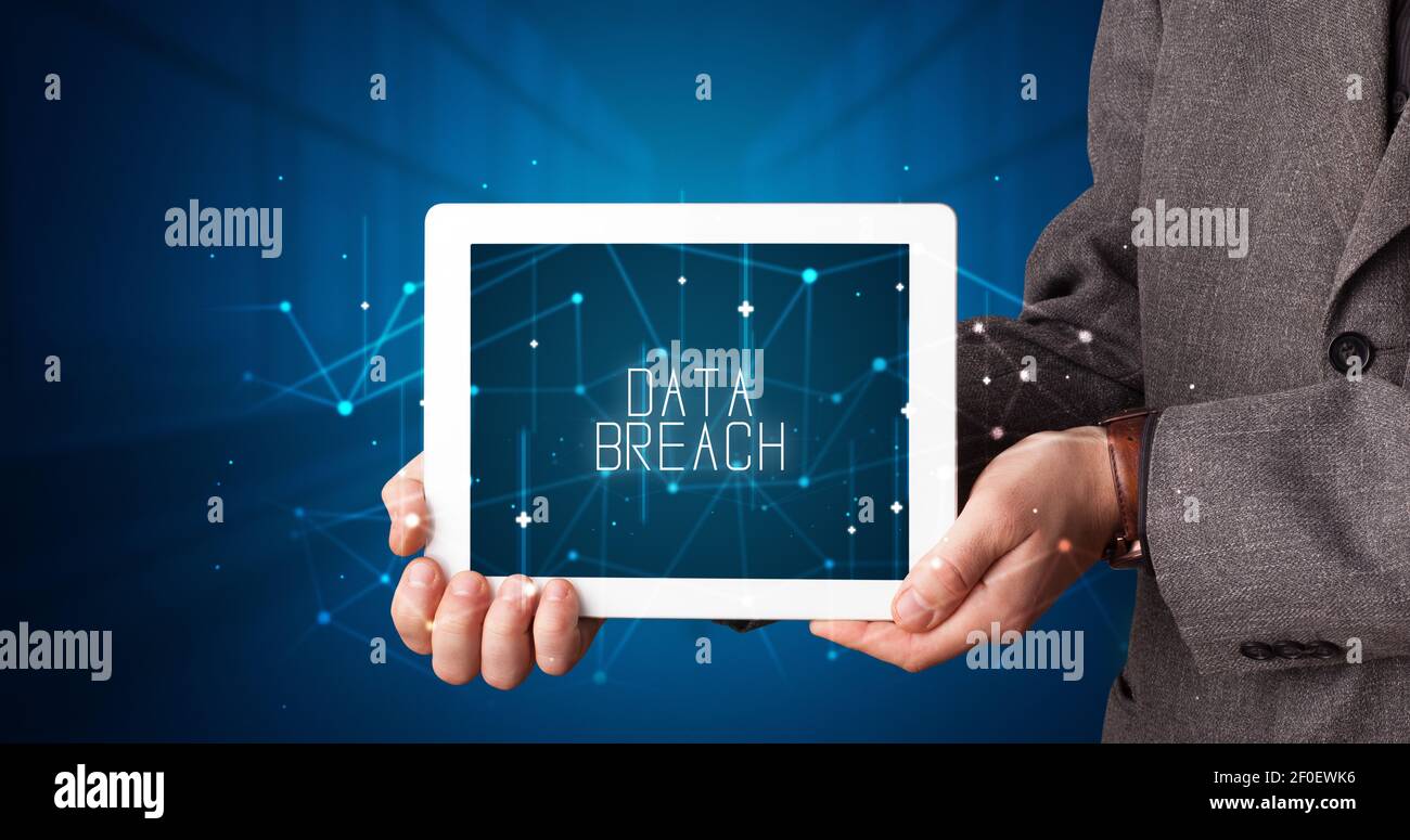 Young business person working on tablet and shows the digital sign ...