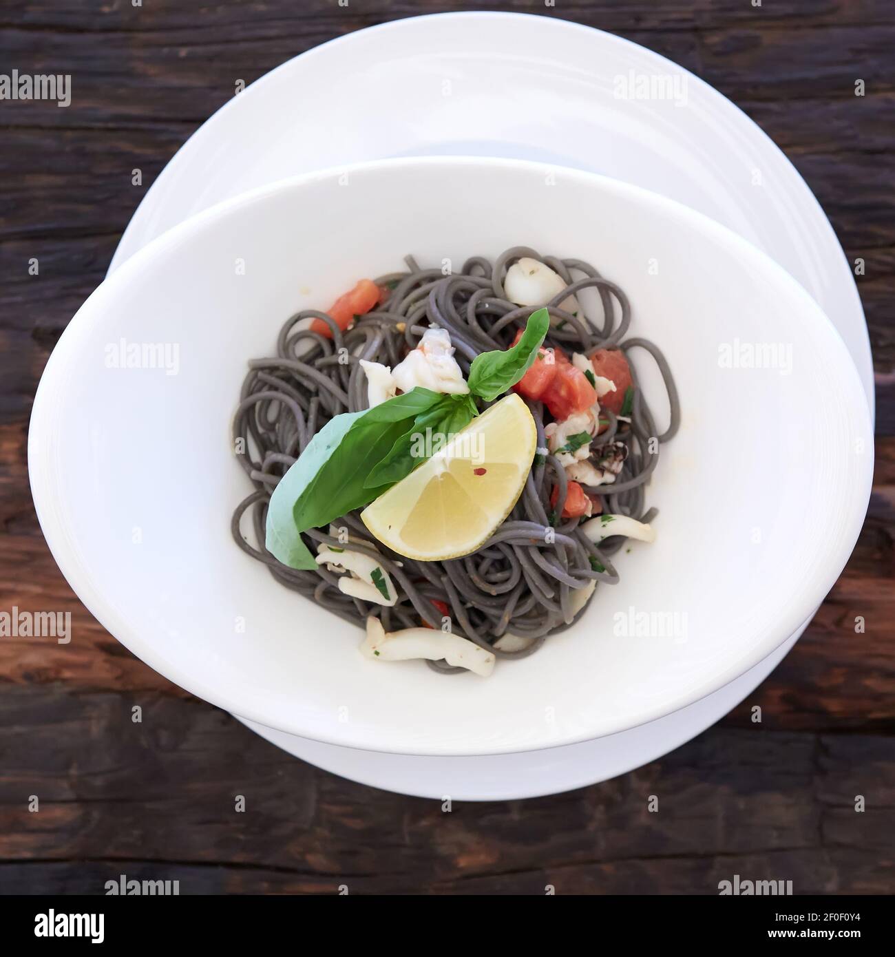 Black spaghetti with prawns and mussels Stock Photo