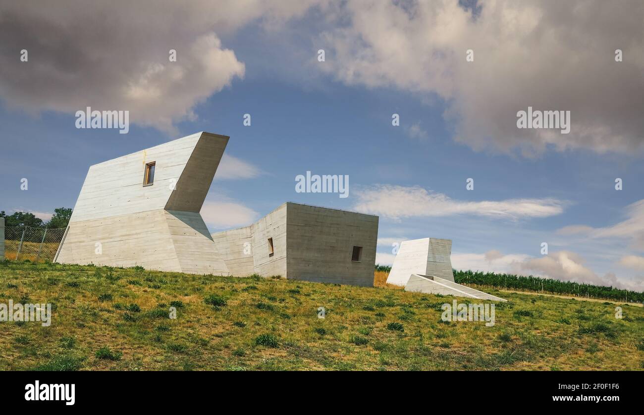 PAVLOV, CZECH REPUBLIC - July 23, 2021: Concrete buildings of Archeopark Pavlov, modern museum of prehistoric locality from time of mammoth hunters.  Stock Photo