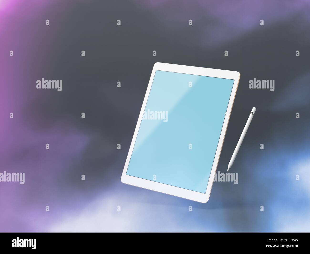 Mock up of a tablet pc, floating over dark background with stylus Stock Photo