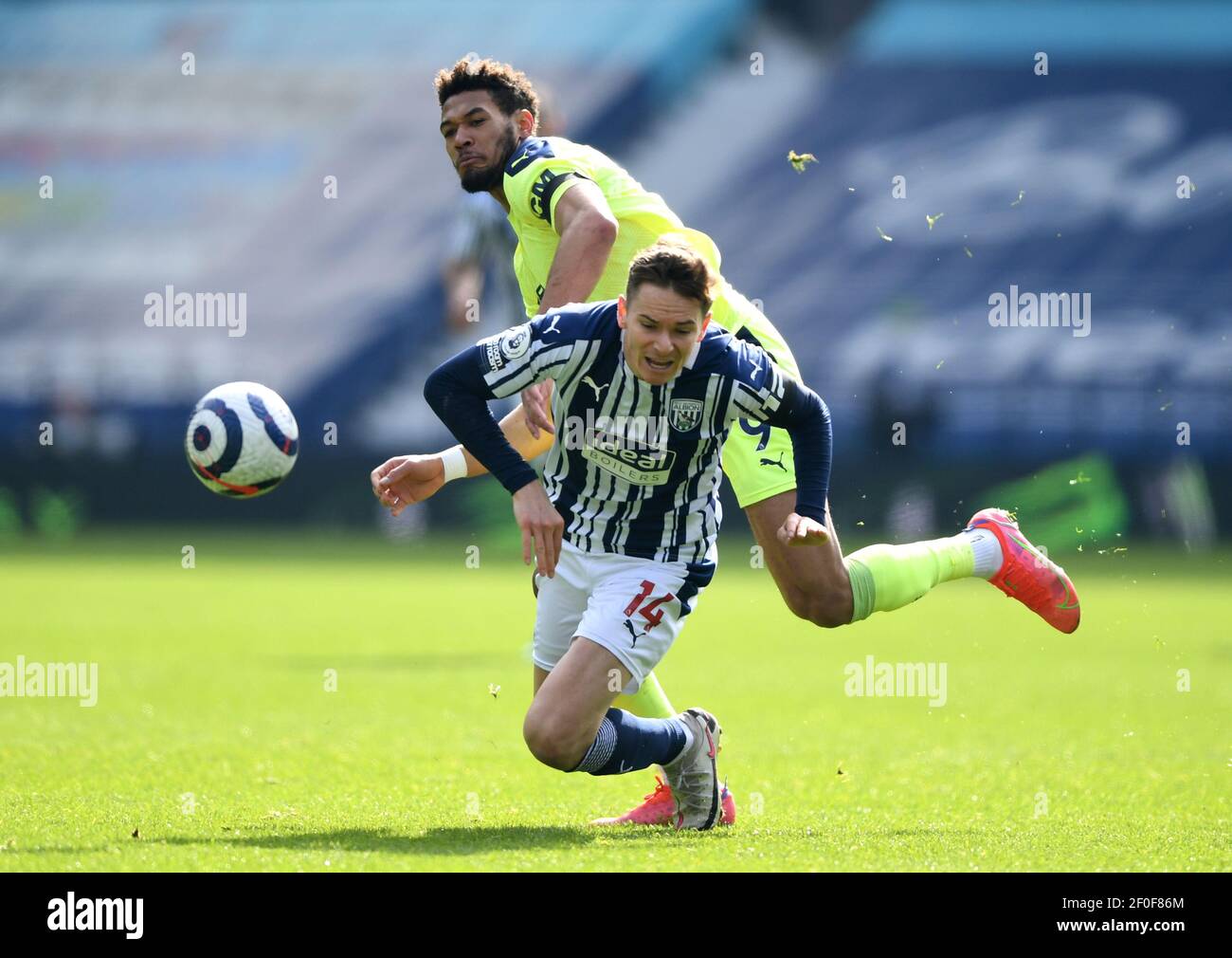 West Bromwich Albion's Conor Townsend collides with Newcastle United's Joelinton during the Premier League match at The Hawthorns, West Bromwich. Picture date: Sunday March 7, 2021. Stock Photo